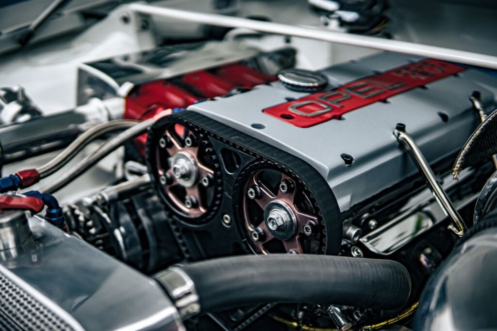 Detailed image showing the inner workings of an Opel car engine with components in focus.